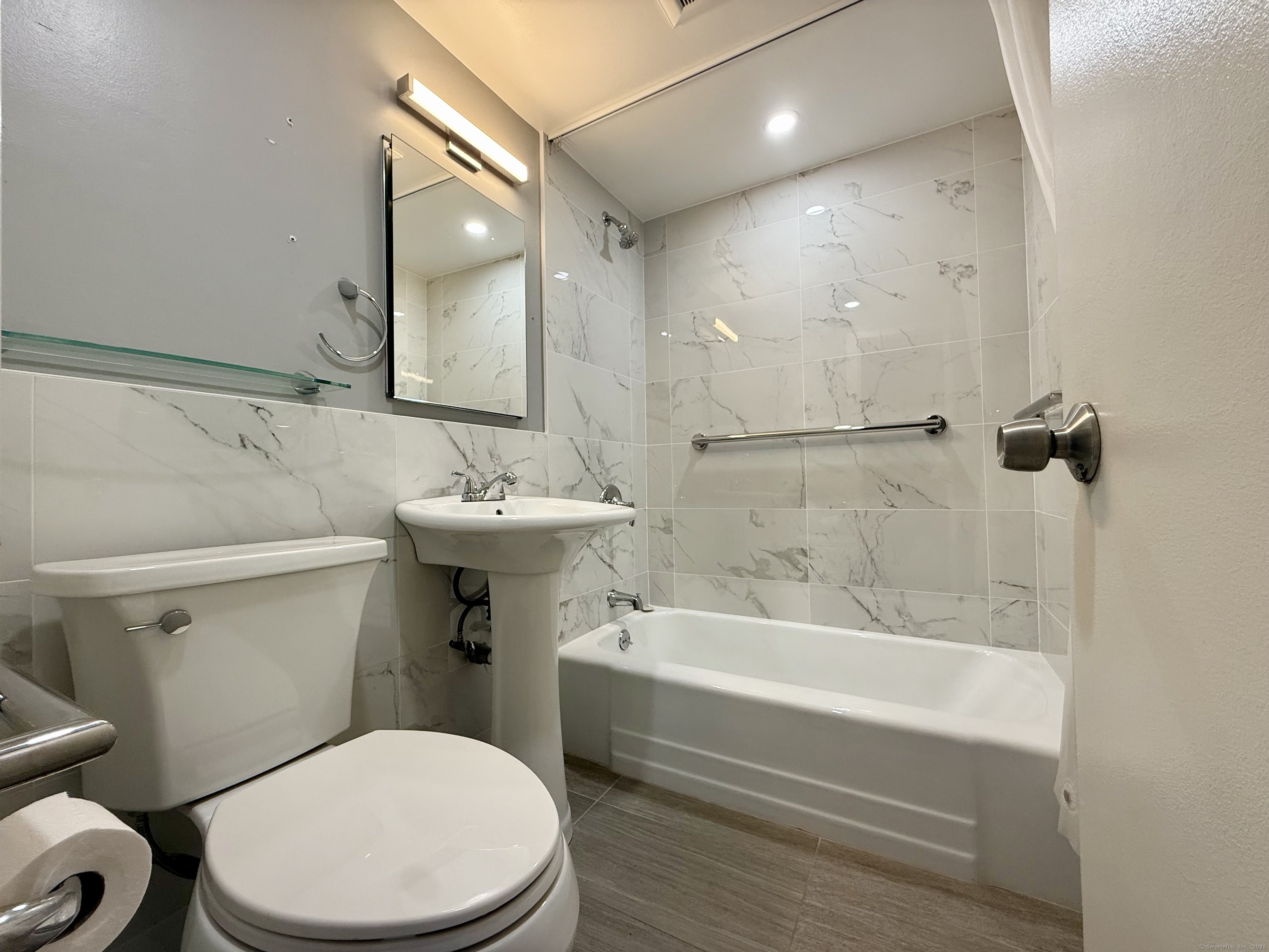 100 York Street, Unit 12S New Haven, CT 06511 - Photo 20 of 35 a bathroom with a sink a toilet and shower