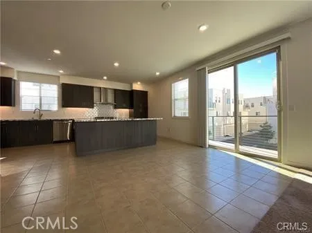 a view of a kitchen with a sink and cabinets