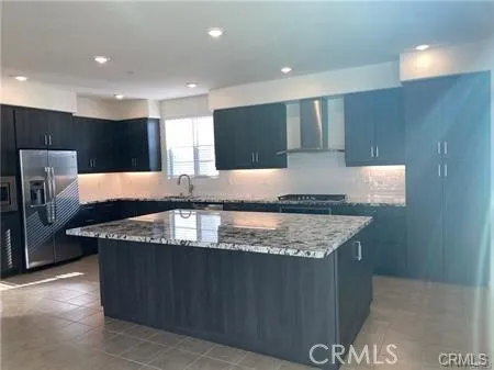 a kitchen with granite countertop a sink and a counter top space