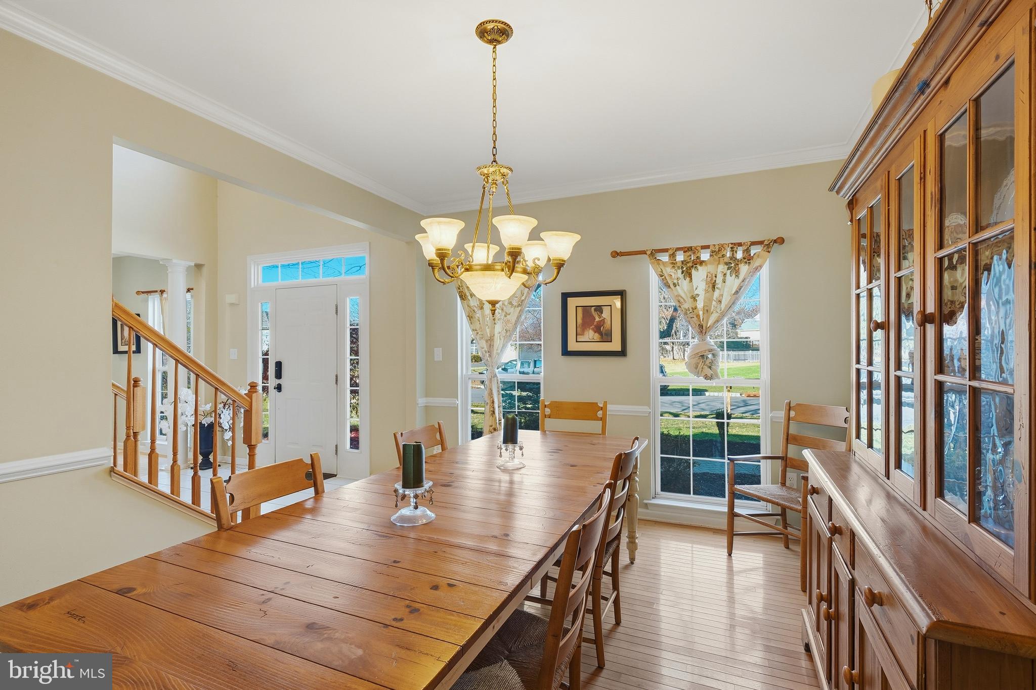 27 Donovan Road Pennington, NJ 08534 - Photo 11 of 60 a view of a dining room with furniture a chandelier and wooden floor