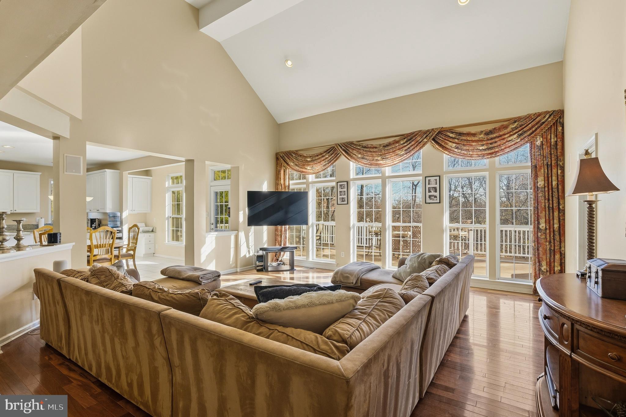 27 Donovan Road Pennington, NJ 08534 - Photo 12 of 60 a living room with furniture a flat screen tv and a large window