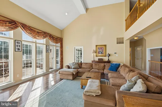 a kitchen with granite countertop white cabinets white stainless steel appliances and a sink