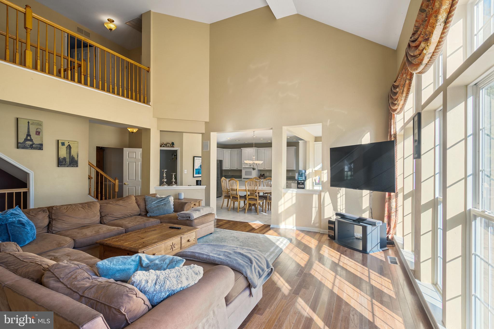 27 Donovan Road Pennington, NJ 08534 - Photo 14 of 60 a living room with a couch and a flat screen tv