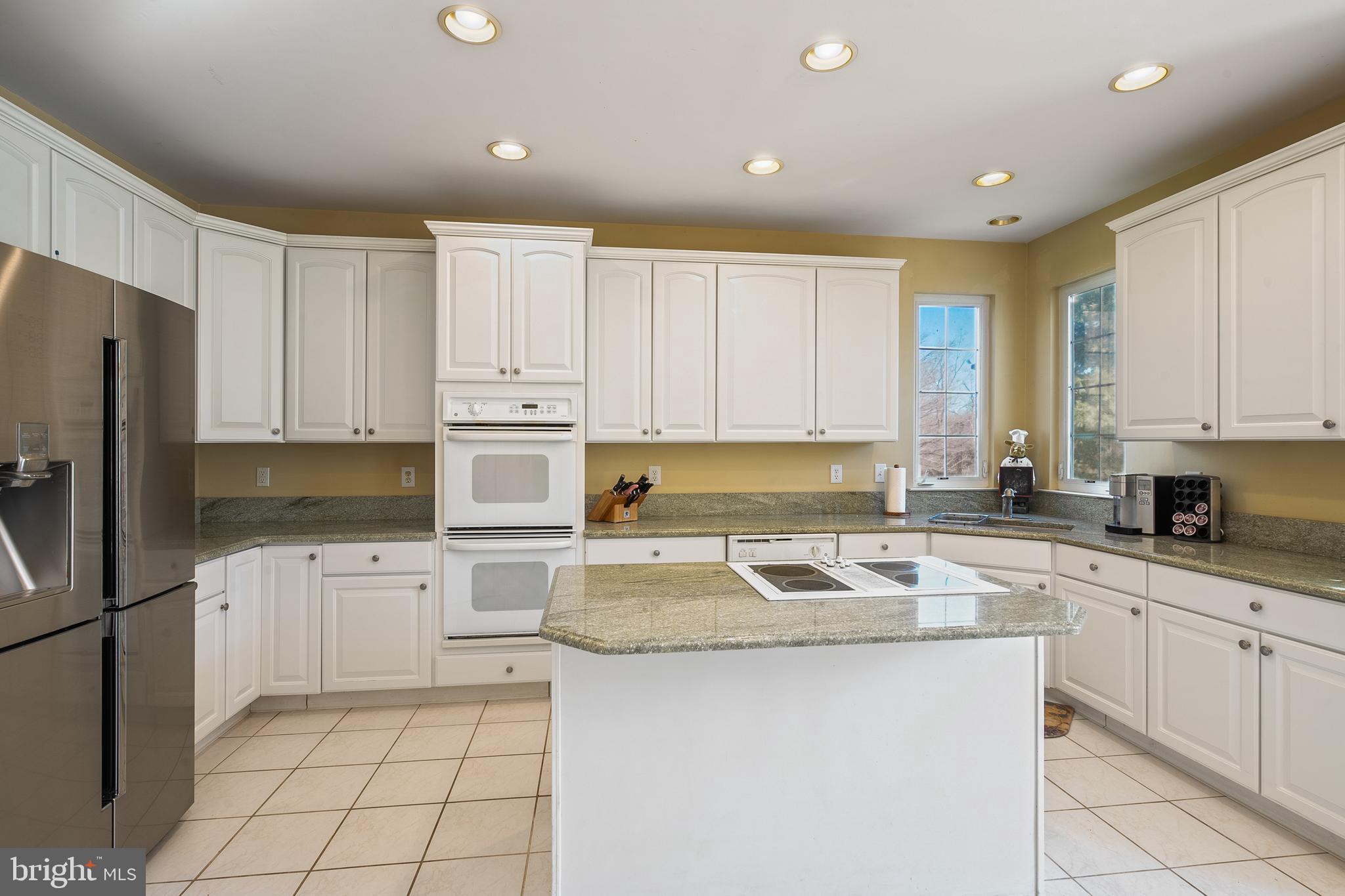 27 Donovan Road Pennington, NJ 08534 - Photo 17 of 60 a kitchen with granite countertop white cabinets white stainless steel appliances and a sink
