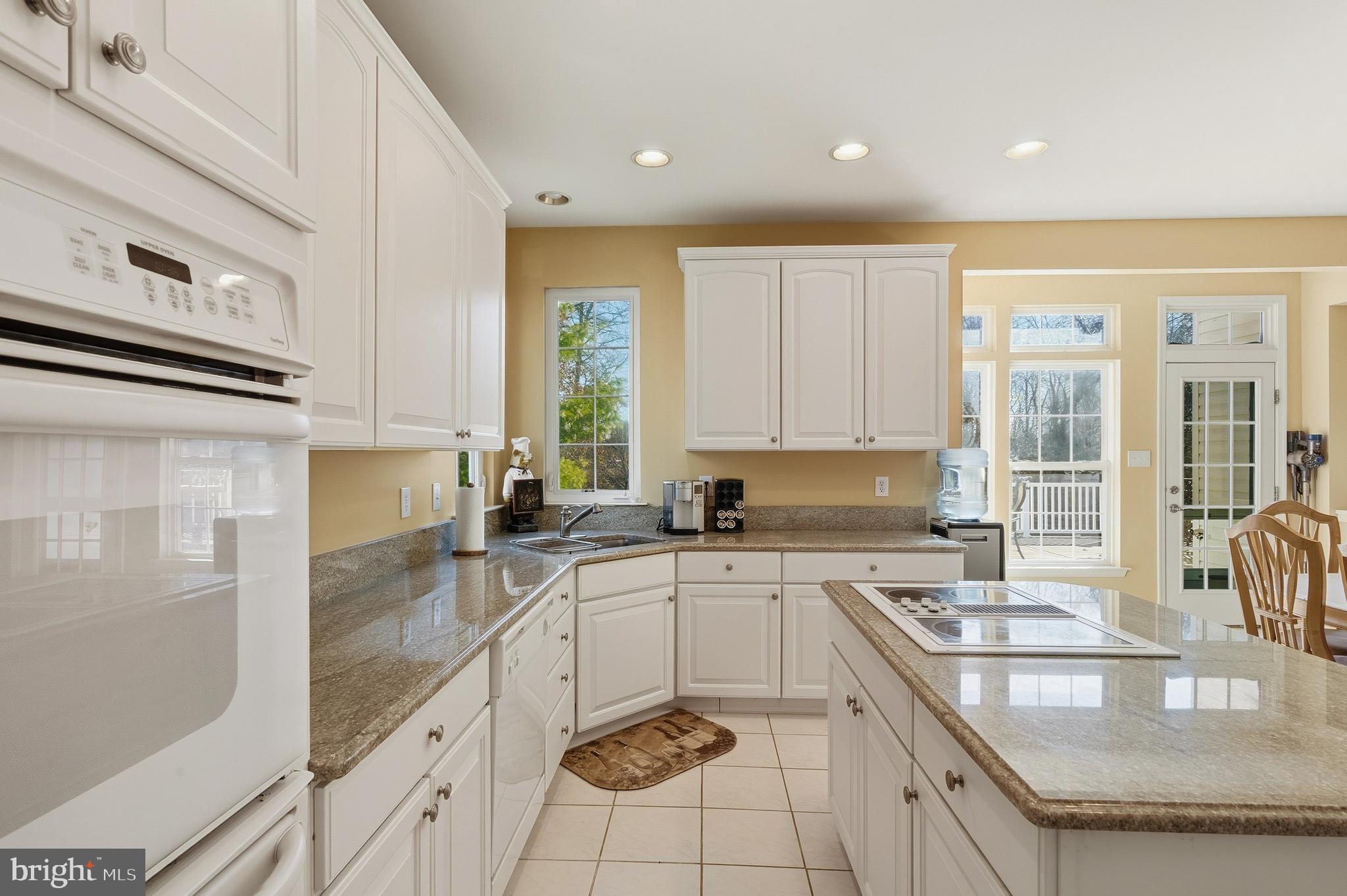 27 Donovan Road Pennington, NJ 08534 - Photo 18 of 60 a kitchen with a sink stove and cabinets