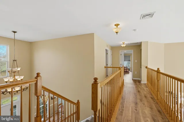 a very nice looking room with a large window and chandelier