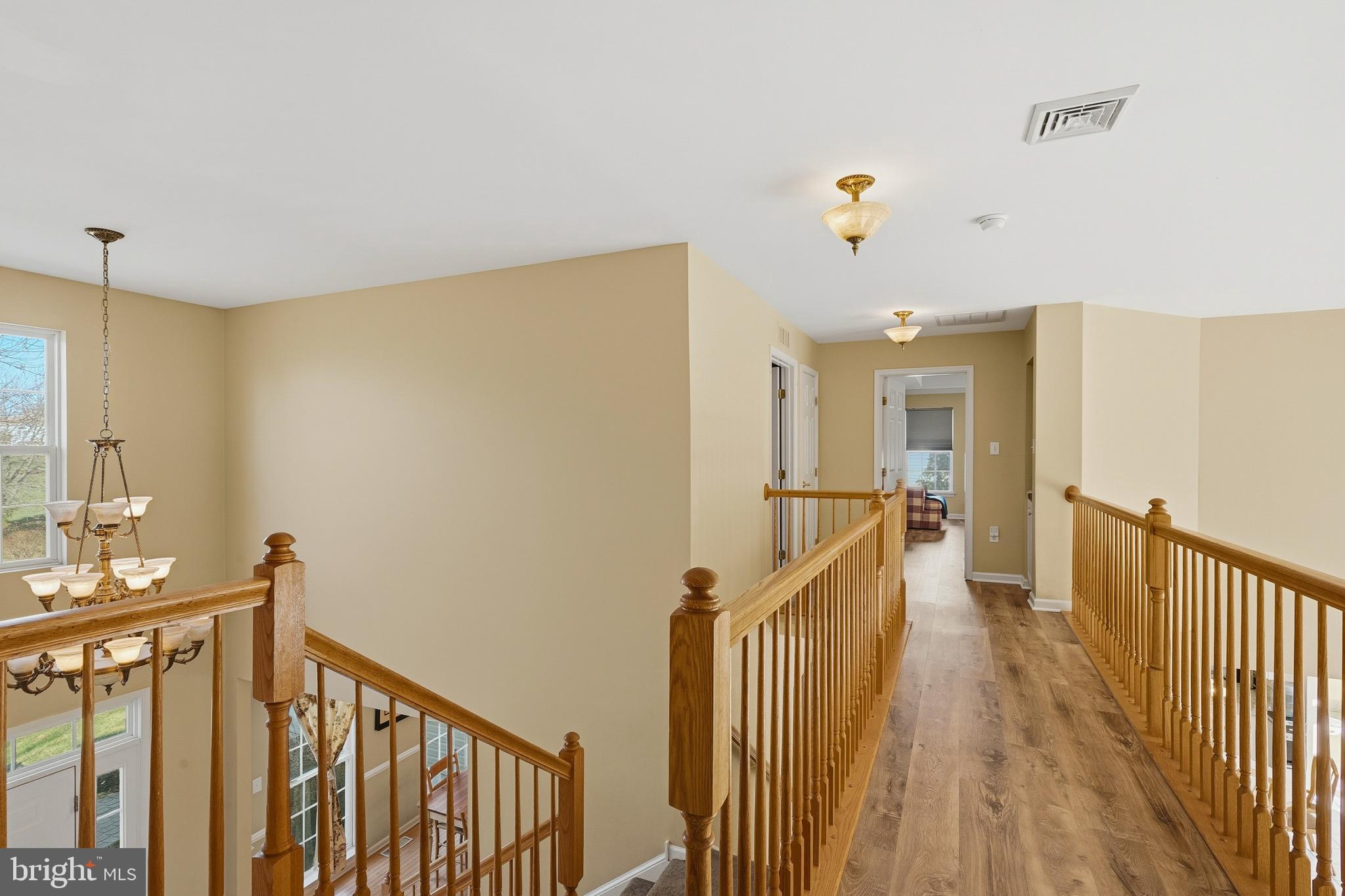 27 Donovan Road Pennington, NJ 08534 - Photo 26 of 60 a view of a hallway with wooden floor and staircase