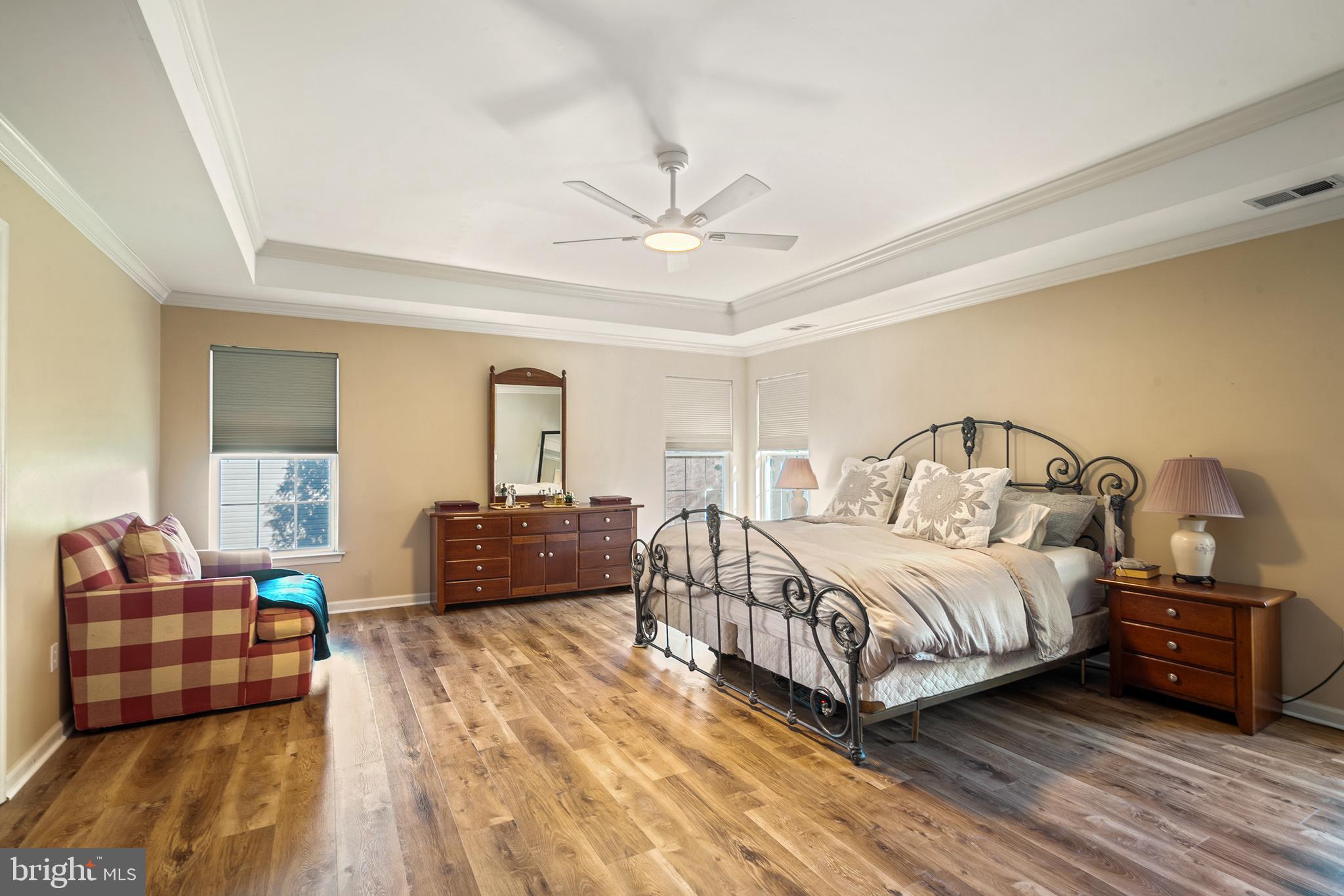 27 Donovan Road Pennington, NJ 08534 - Photo 28 of 60 a bedroom with a bed and wooden floor