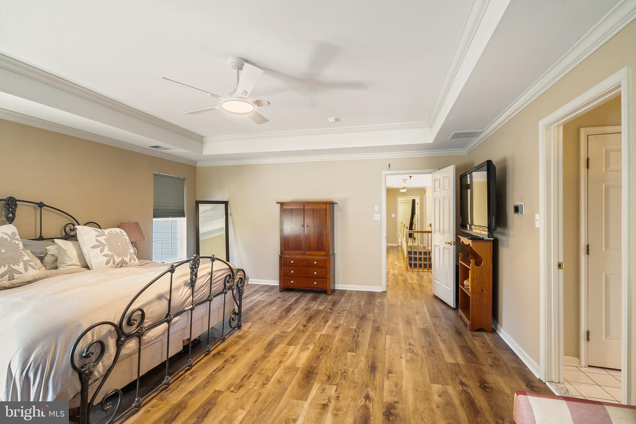 27 Donovan Road Pennington, NJ 08534 - Photo 29 of 60 a bedroom with a large bed and a chandelier