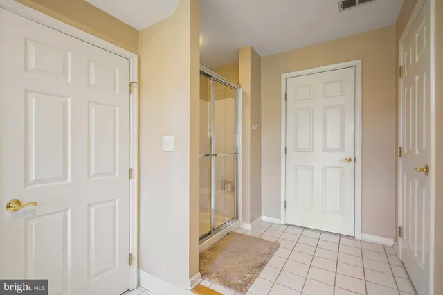 a bedroom with a bed and a desk