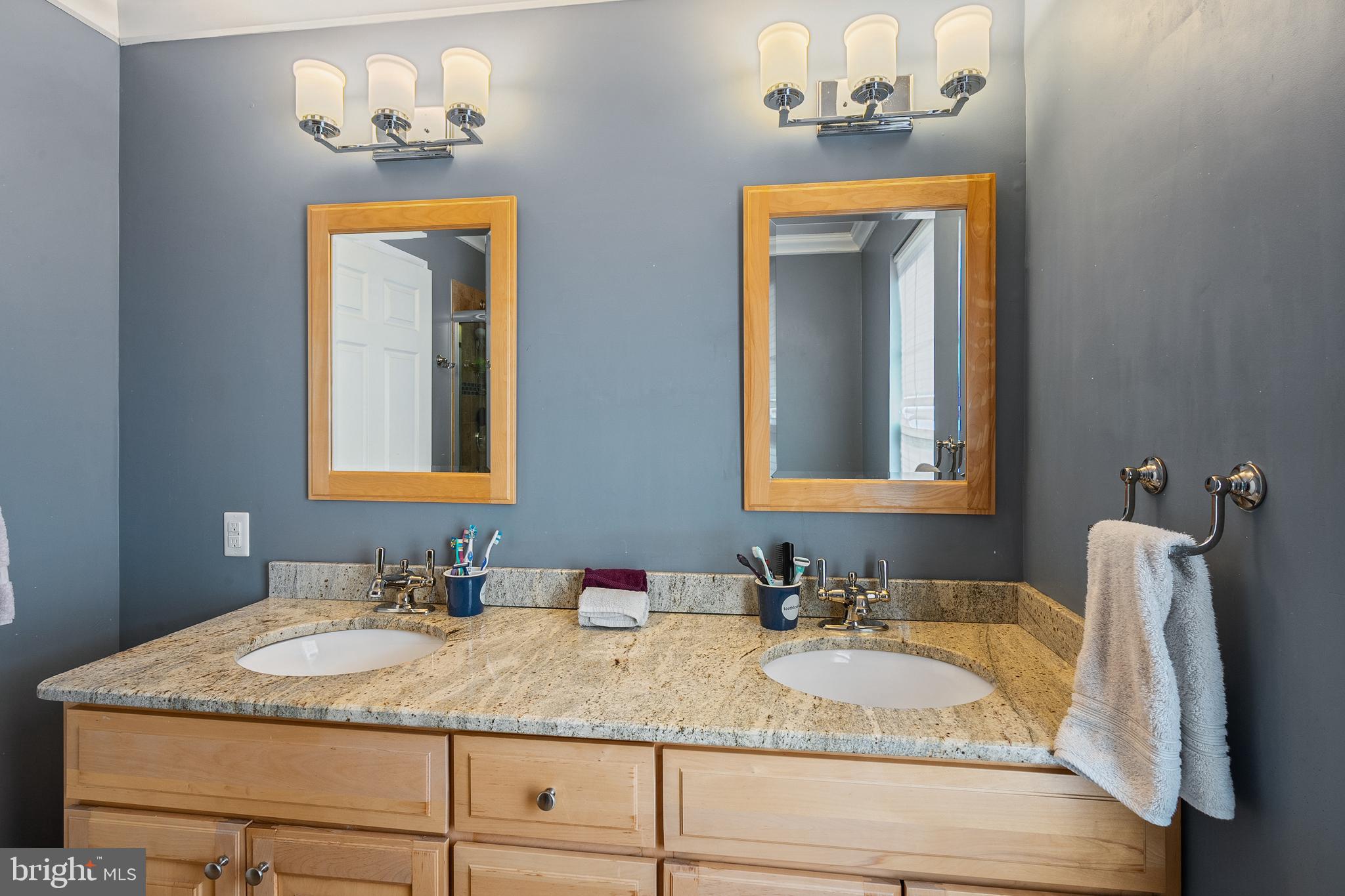 27 Donovan Road Pennington, NJ 08534 - Photo 38 of 60 a bathroom with a granite countertop sink and a mirror