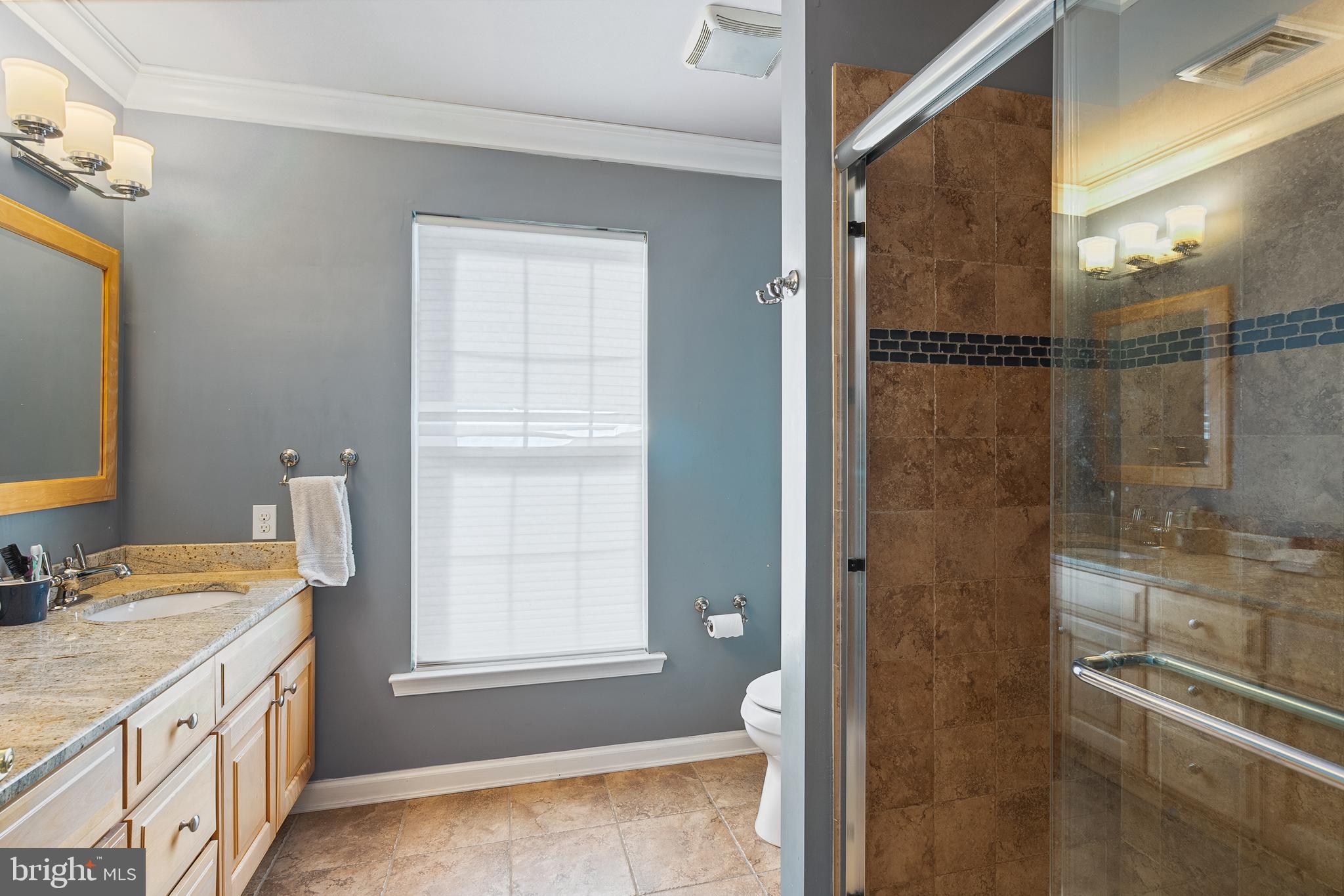 27 Donovan Road Pennington, NJ 08534 - Photo 39 of 60 a bathroom with a granite countertop sink a mirror and a shower