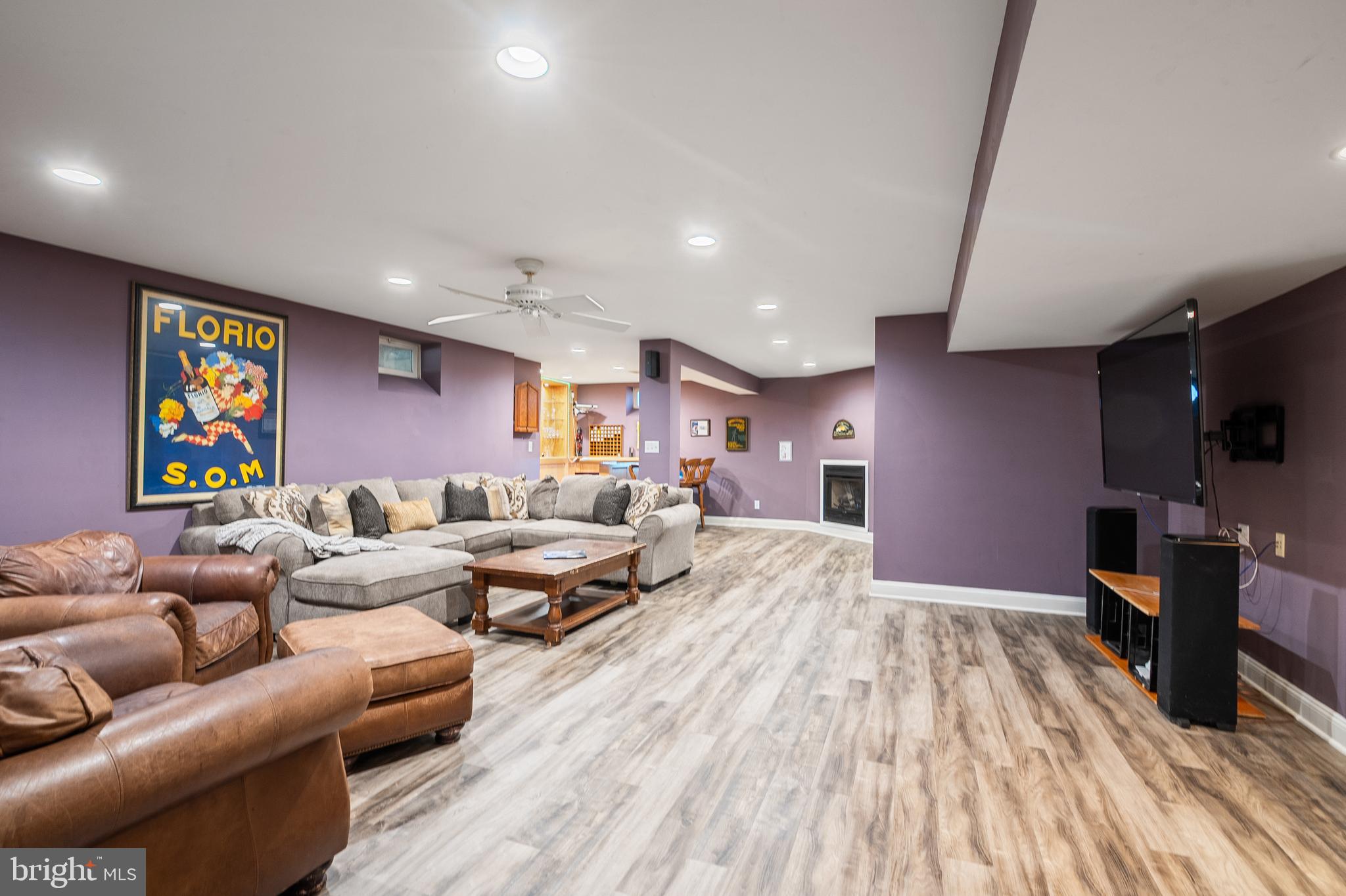 27 Donovan Road Pennington, NJ 08534 - Photo 40 of 60 a living room with furniture and a flat screen tv