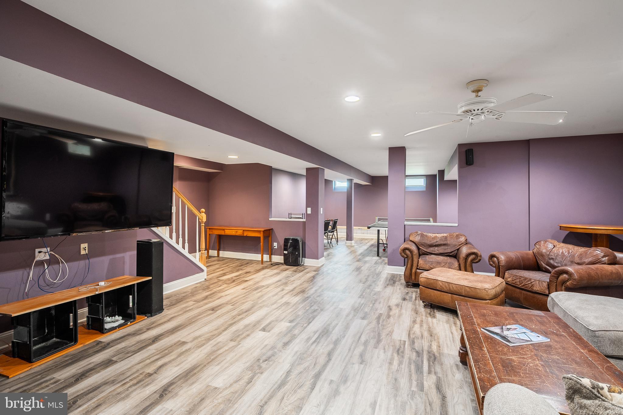27 Donovan Road Pennington, NJ 08534 - Photo 41 of 60 a living room with furniture and a flat screen tv