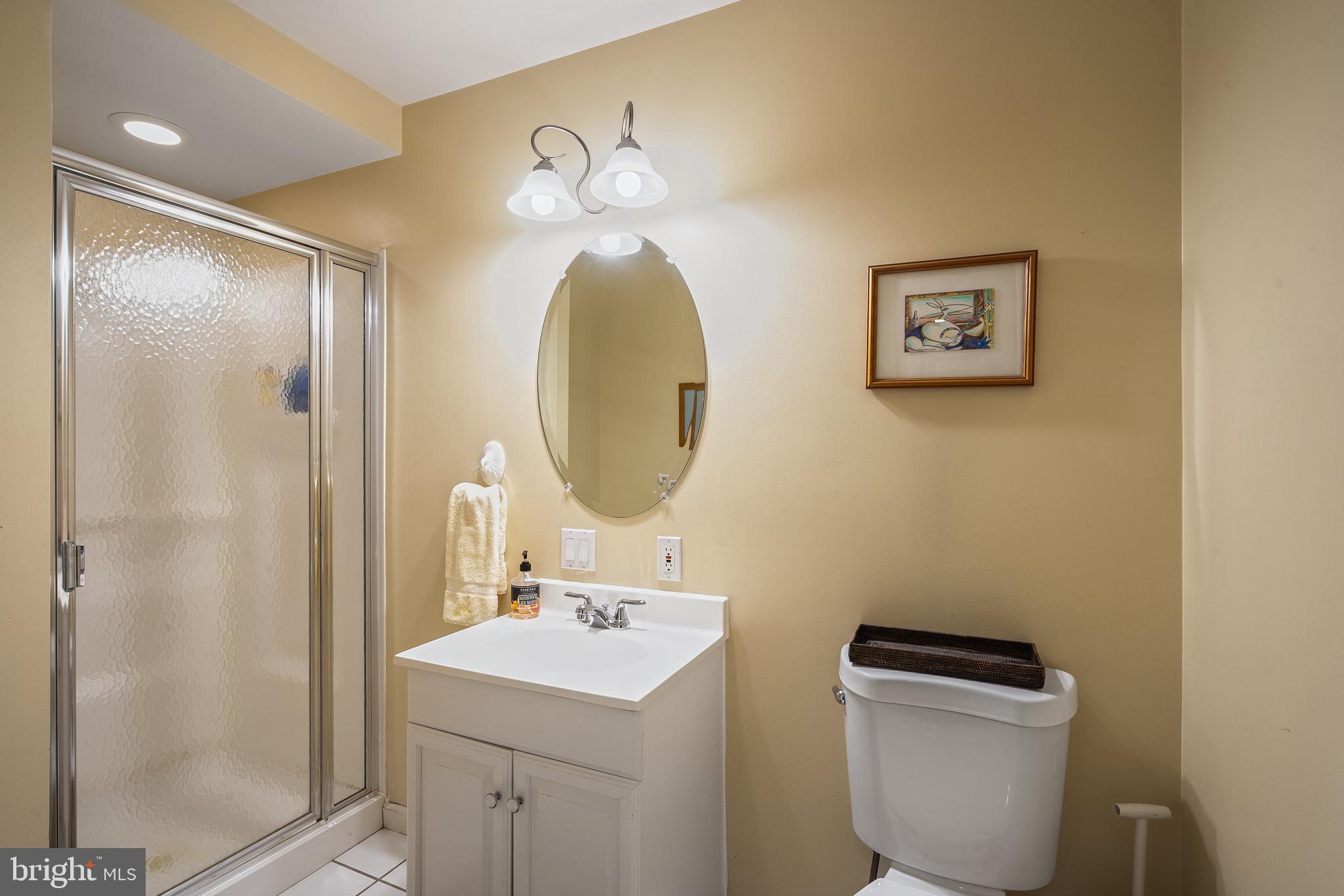 27 Donovan Road Pennington, NJ 08534 - Photo 46 of 60 a bathroom with a toilet a sink and mirror
