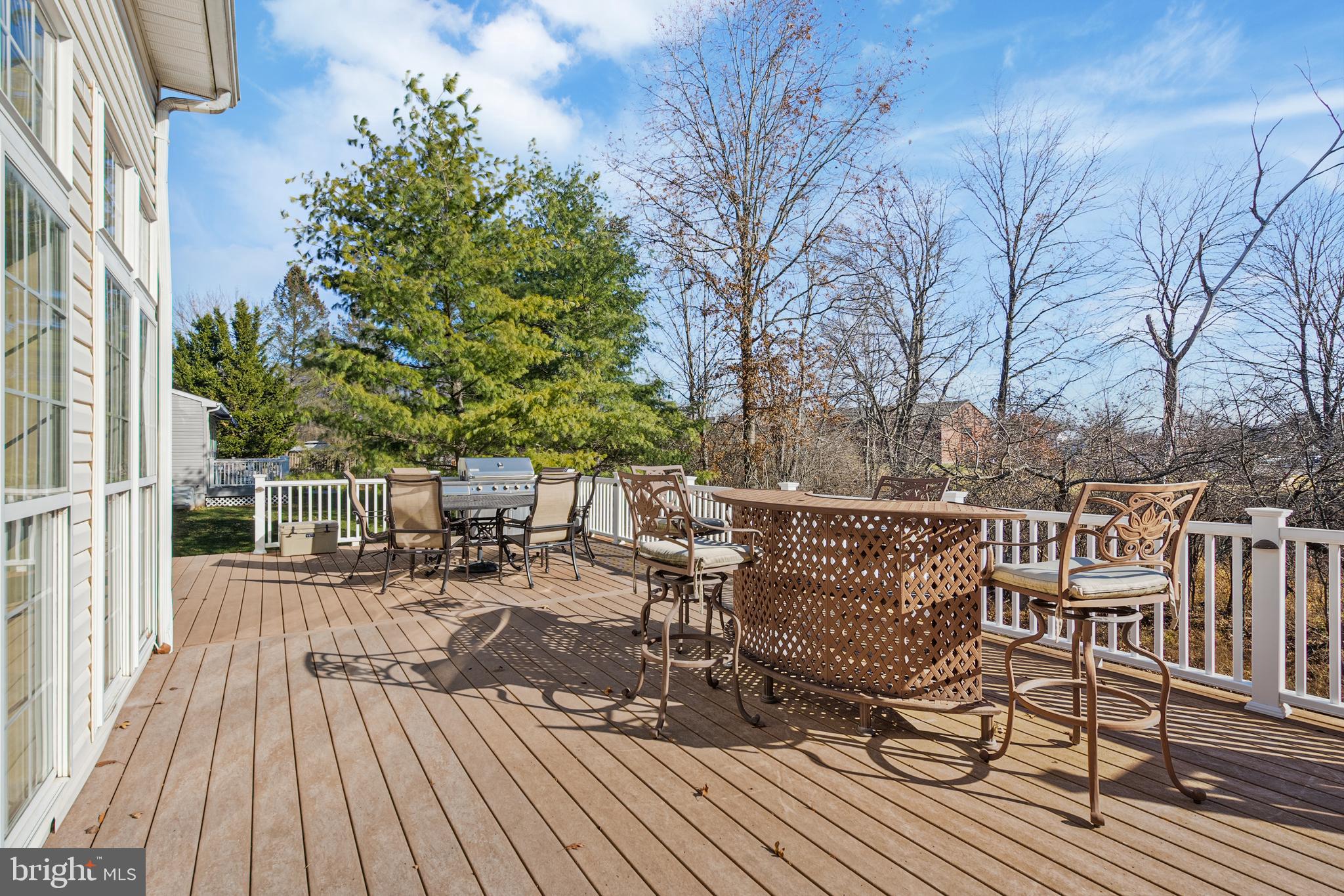 27 Donovan Road Pennington, NJ 08534 - Photo 6 of 60 a view of balcony with outdoor seating and wooden floor