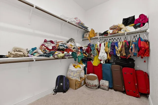 a spacious bathroom with a tub sink and mirror