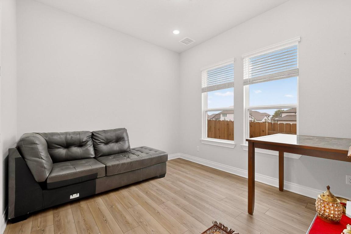 1304 Snowdrop Drive Georgetown, TX 78628 - Photo 17 of 27 a living room with furniture and a window