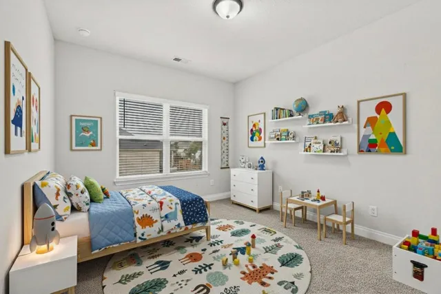 a bedroom with a bed and window