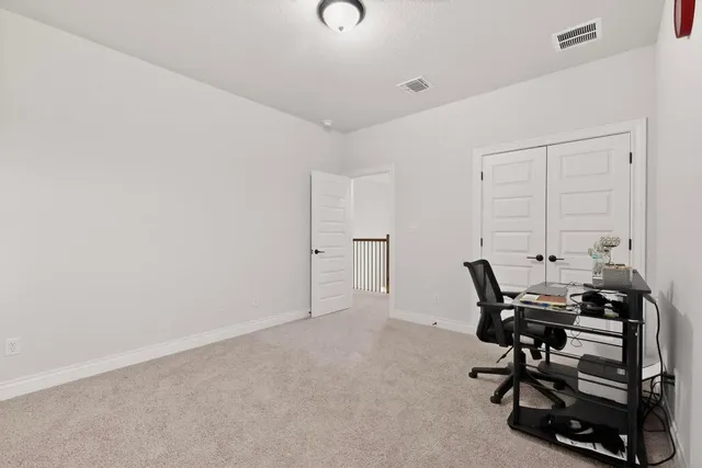 a bedroom with bed and a window