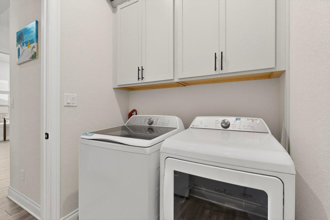 1304 Snowdrop Drive Georgetown, TX 78628 - Photo 23 of 27 a utility room with dryer and washer