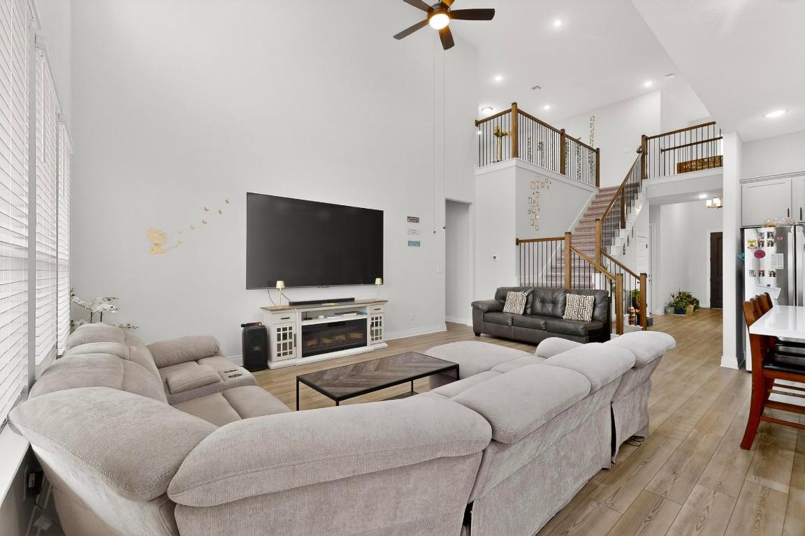 1304 Snowdrop Drive Georgetown, TX 78628 - Photo 8 of 27 a living room with furniture and a flat screen tv