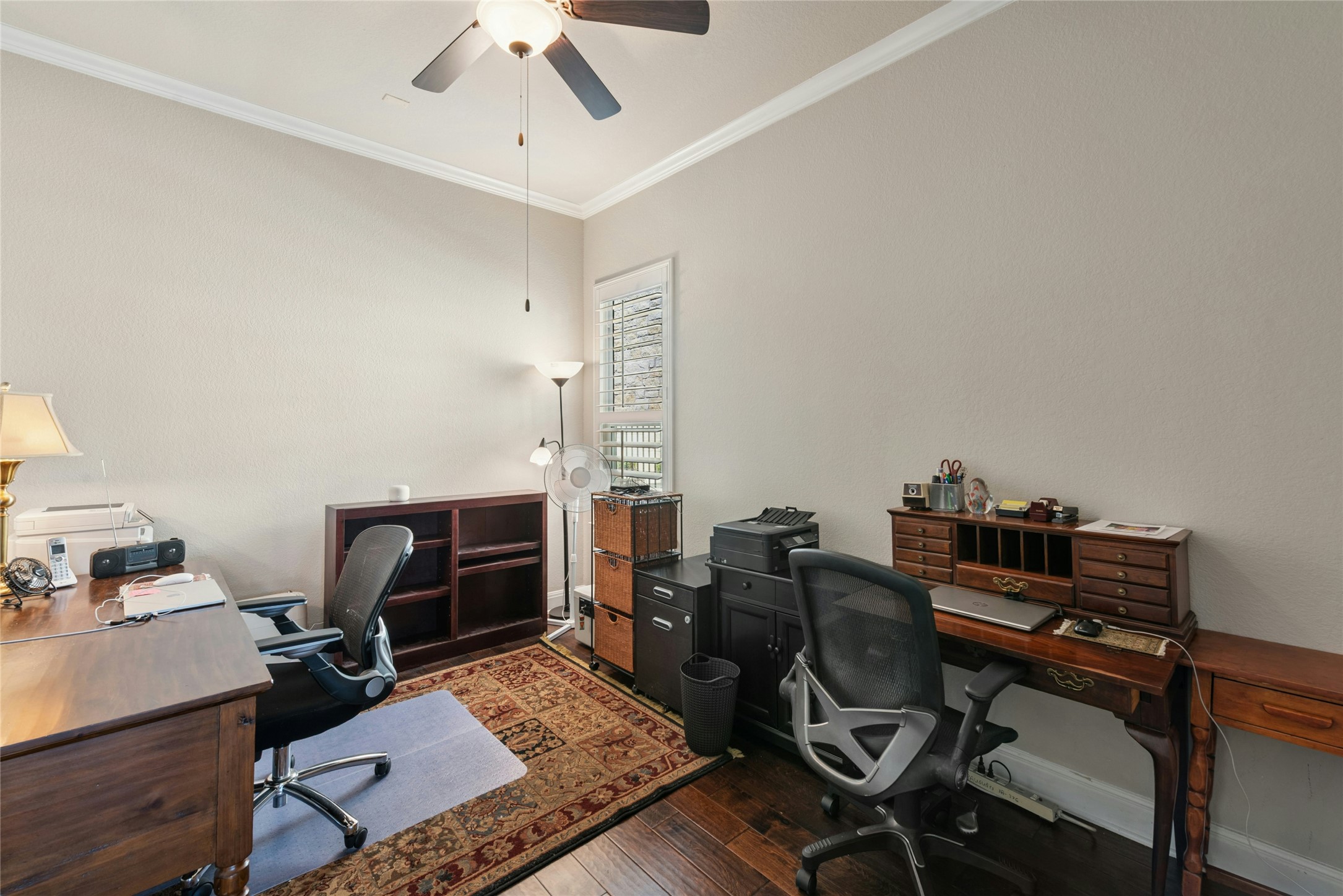 116 Evolutions Path Lakeway, TX 78738 - Photo 26 of 34 Office area featuring dark wood-type flooring, crown molding, and a ceiling fan