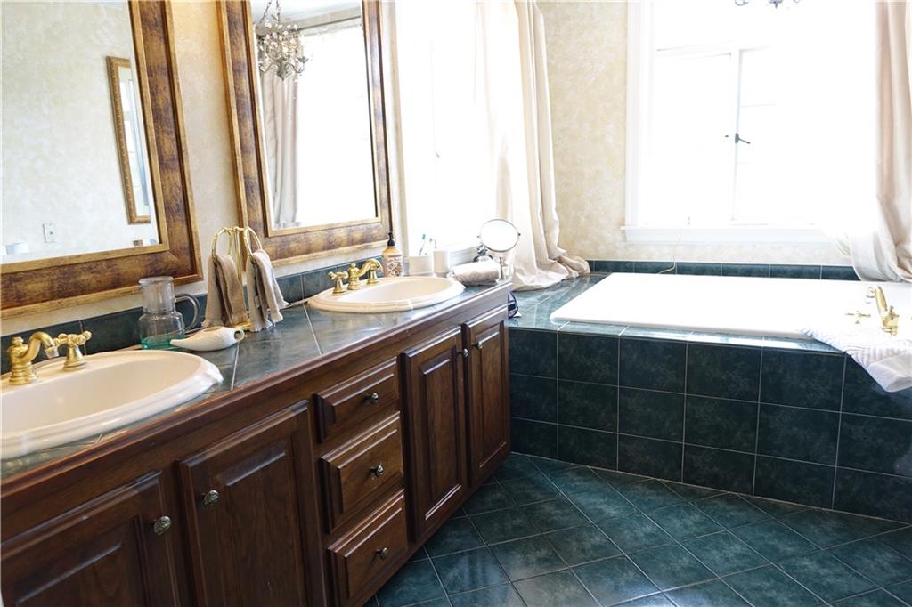 227 Meridian Road Butler, PA 16001 - Photo 16 of 25 Master bathroom with double bowl sinks, jet tub, and large ceramic shower