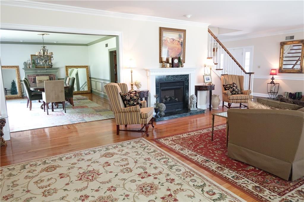 227 Meridian Road Butler, PA 16001 - Photo 3 of 25 Spacious Formal Living Room with hardwood flooring, fireplace, and den area
