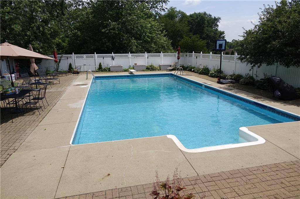 227 Meridian Road Butler, PA 16001 - Photo 25 of 25 In ground pool with diving board, steps, and pool house