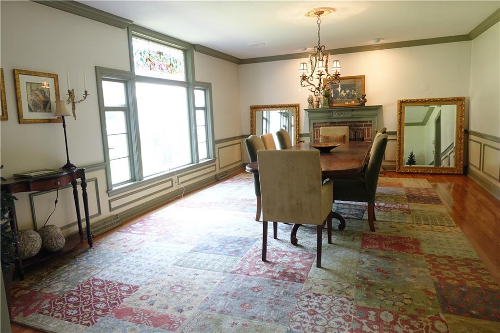 227 Meridian Road Butler, PA 16001 - Photo 4 of 25 Spacious Formal Dining Room with hardwood flooring, fireplace, and stain glass window