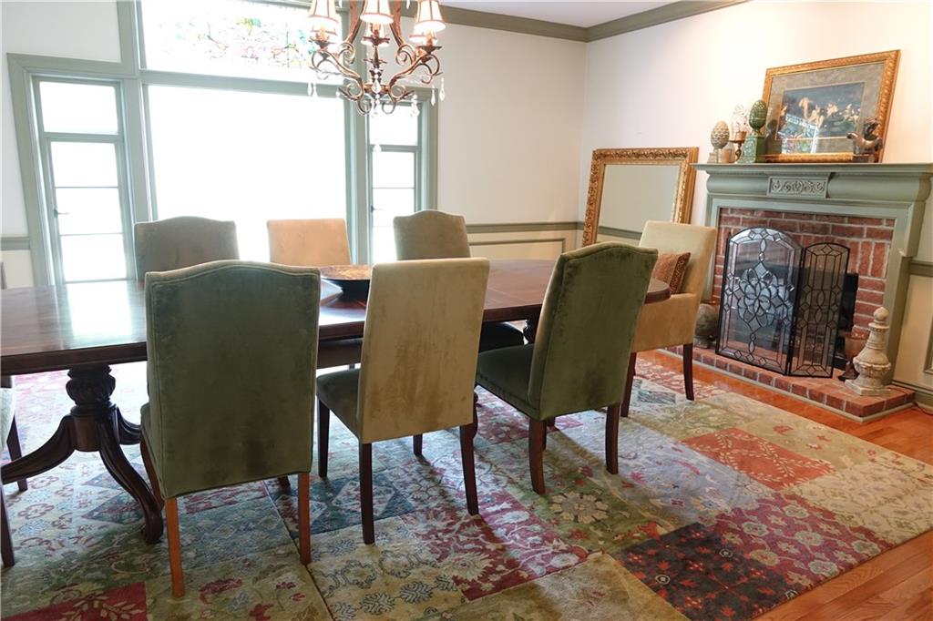 227 Meridian Road Butler, PA 16001 - Photo 5 of 25 Spacious Formal Dining Room with hardwood flooring, fireplace, and stain glass window