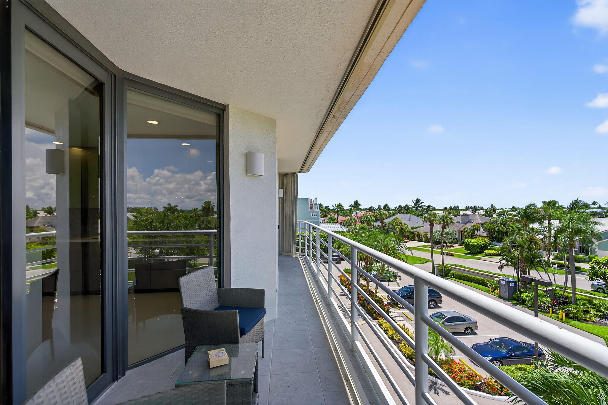 176 Helios Drive, Unit 210 Jupiter, FL 33477 - Photo 31 of 47 Balcony with Sunset & Tennis Views
