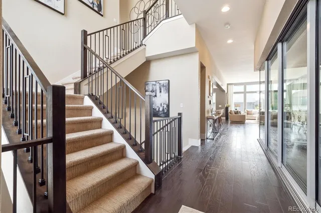 a view of staircase with wooden floor and a floor to ceiling window
