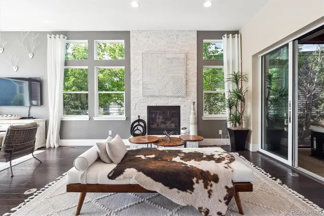 a bedroom with a bed a large window and a couch