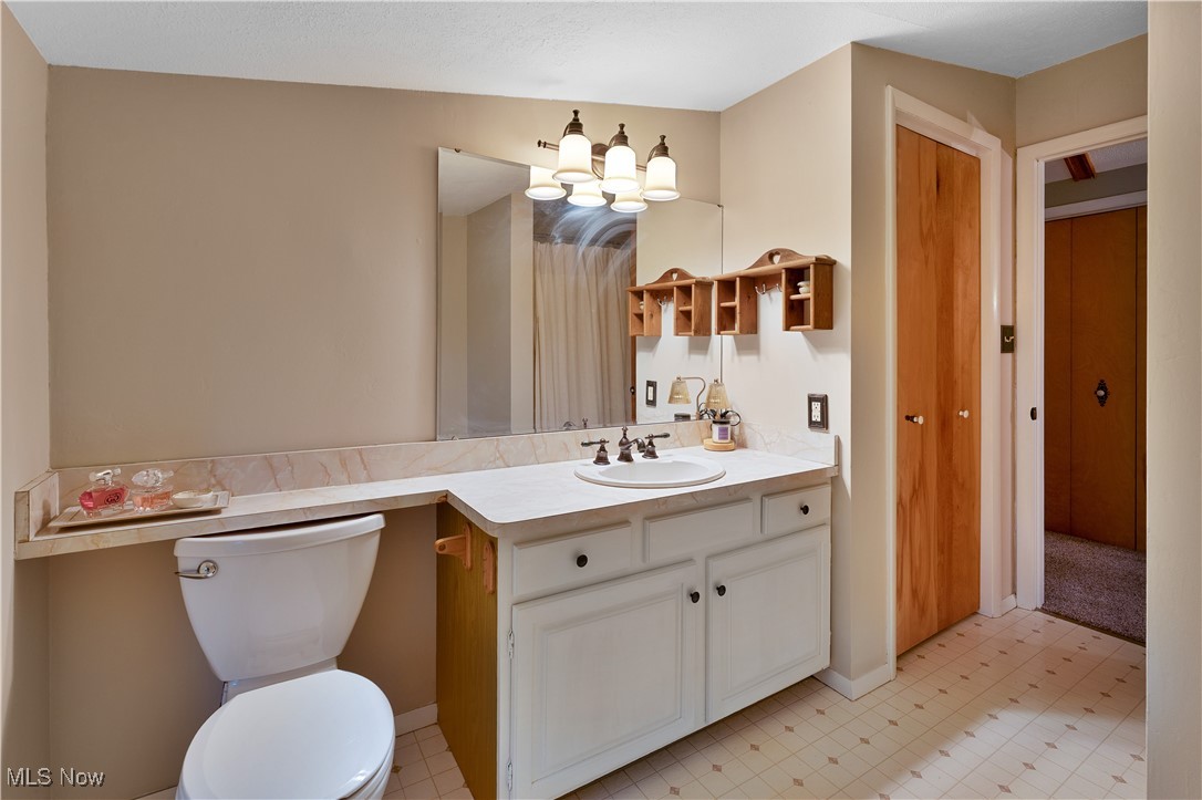 6370 Fairview Road Youngstown, OH 44515 - Photo 29 of 38 Upstairs full bathroom featuring vanity, light flooring, and curtained shower
