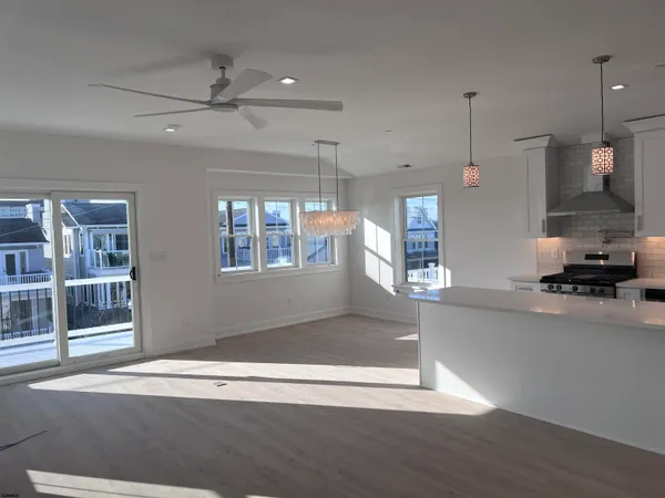 a view of a kitchen with a sink and a window