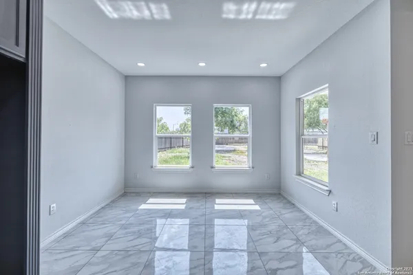 a view of an empty room with a window