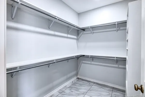 a view of an empty walk in closet