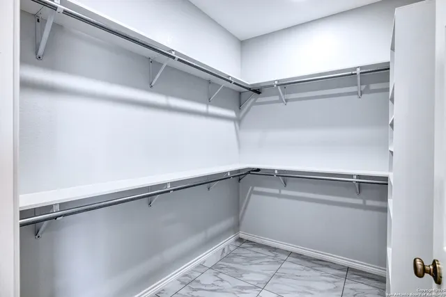 a view of an empty walk in closet