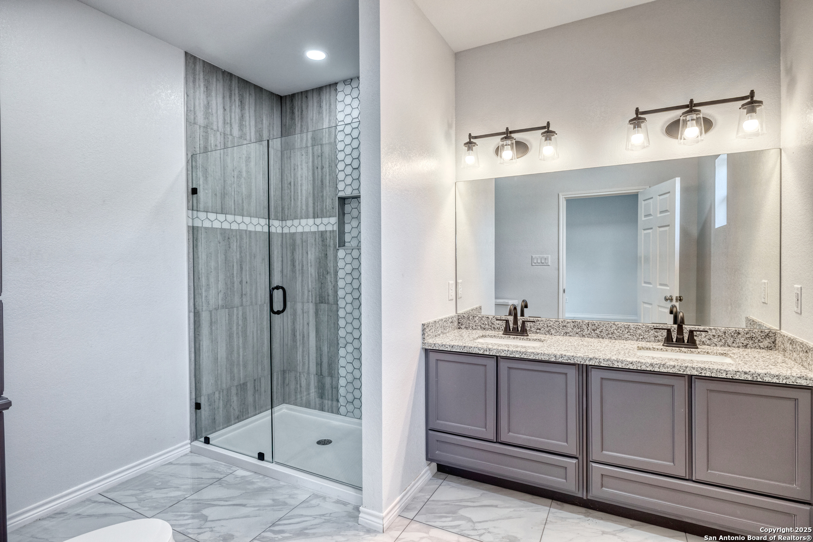 44 Sunday Court Uvalde, TX 78801 - Photo 19 of 30 a bathroom with a sink and a mirror