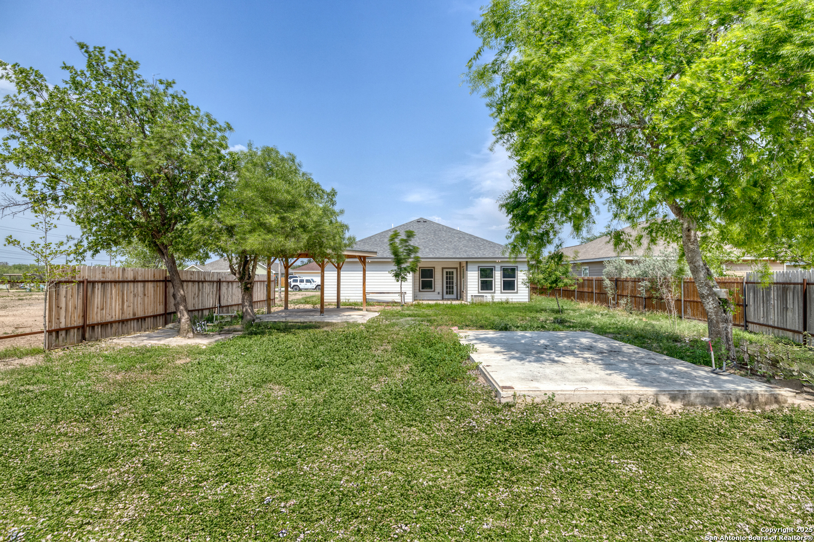 44 Sunday Court Uvalde, TX 78801 - Photo 24 of 30 a view of yard in front of house with trees all around