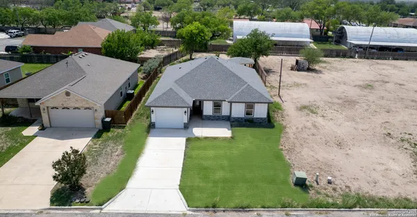 an aerial view of a house with a garden
