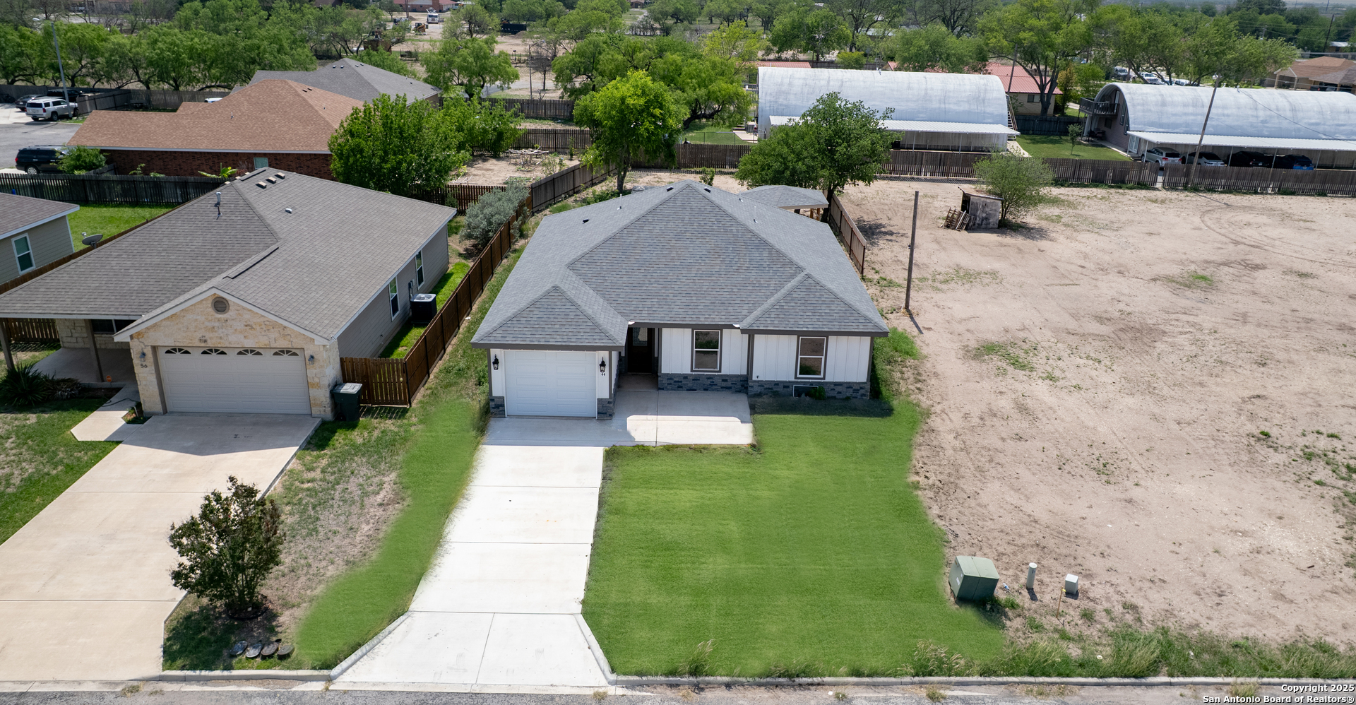 44 Sunday Court Uvalde, TX 78801 - Photo 26 of 30 an aerial view of a house with a garden