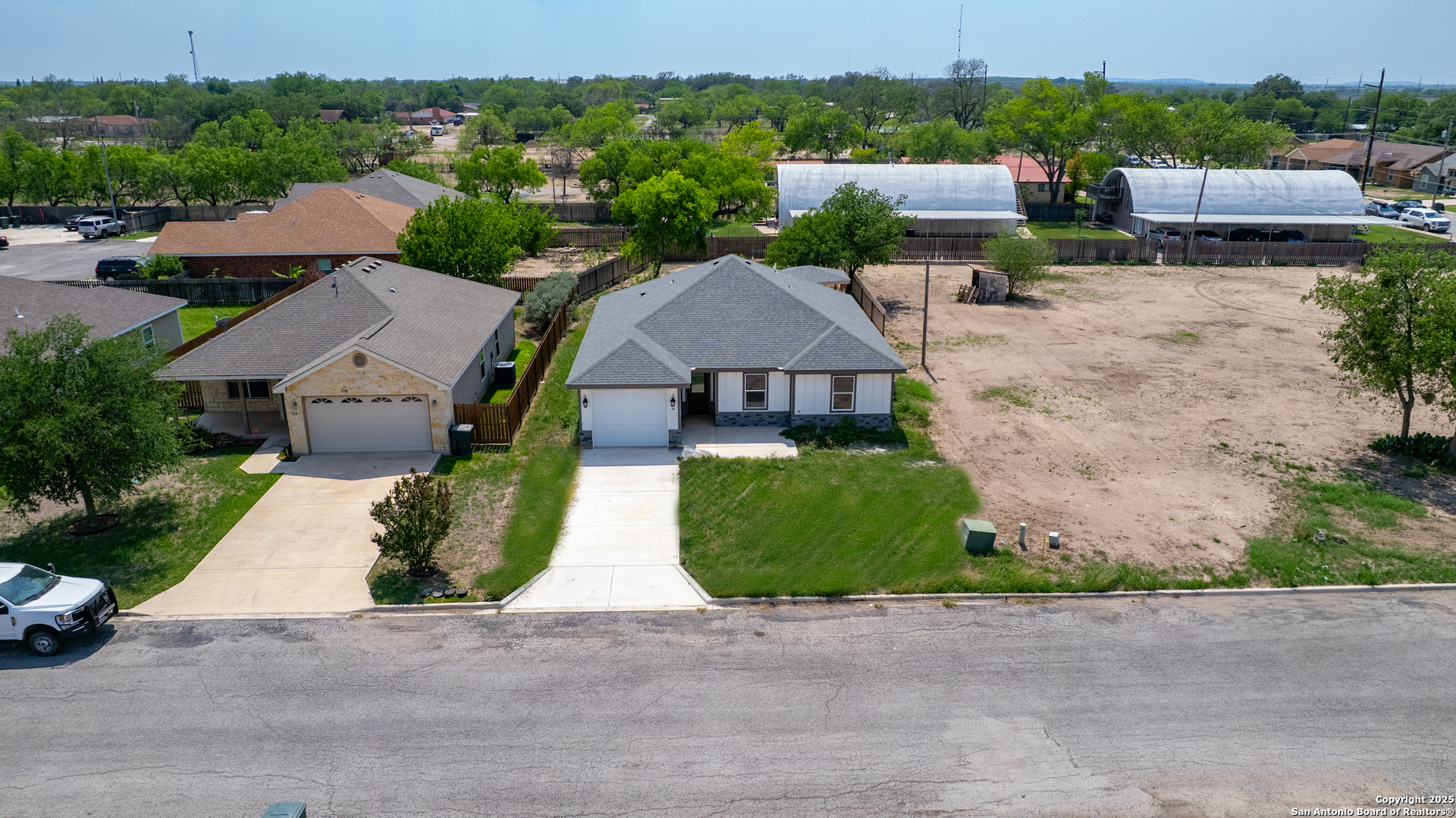 44 Sunday Court Uvalde, TX 78801 - Photo 27 of 30 an aerial view of a house with a garden and plants