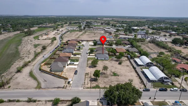 an aerial view of residential houses with outdoor space
