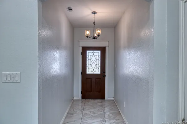 a view of a hallway with windows