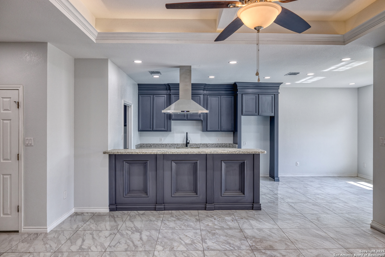 44 Sunday Court Uvalde, TX 78801 - Photo 4 of 30 a view of a kitchen with a sink and chandelier