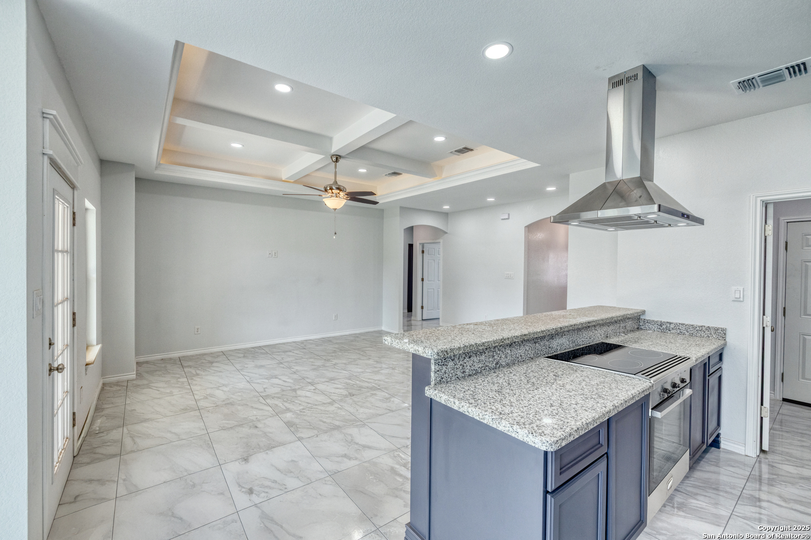 44 Sunday Court Uvalde, TX 78801 - Photo 7 of 30 a kitchen with granite countertop a sink and a stove