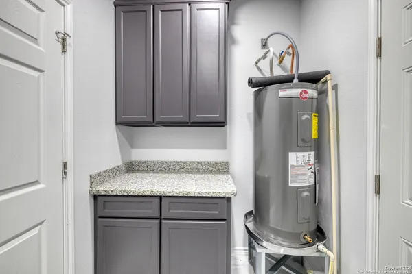 a kitchen with a refrigerator and cabinets
